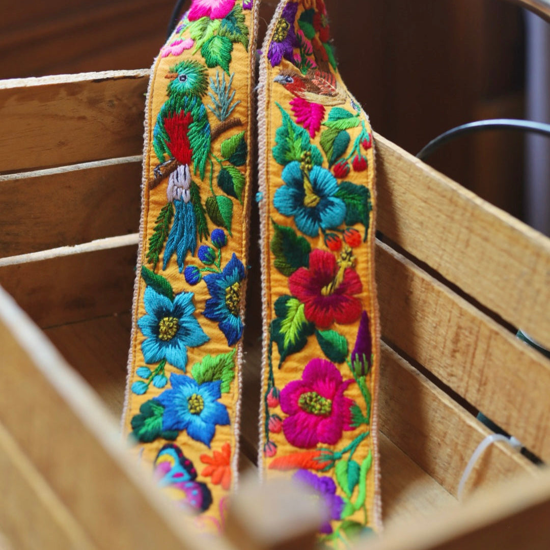 Colorful embroidered strap on a wooden surface