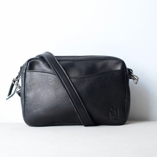 Black leather crossbody bag on a white background
