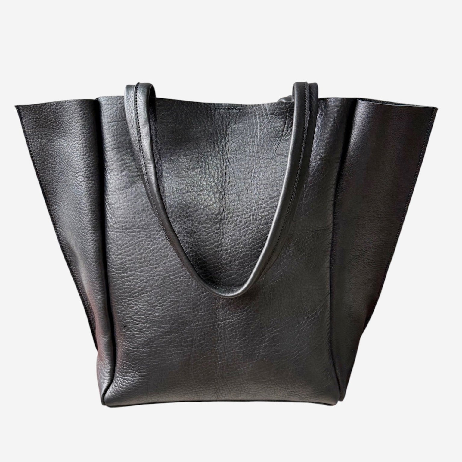 Black leather tote bag on a white background