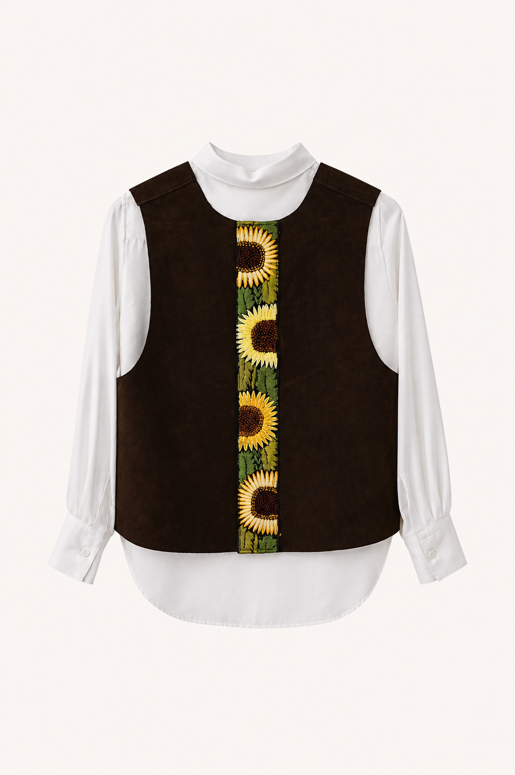A dark brown suede vest layered over a white long-sleeve mock-neck blouse, featuring a vertical embroidered sunflower pattern down the center front.