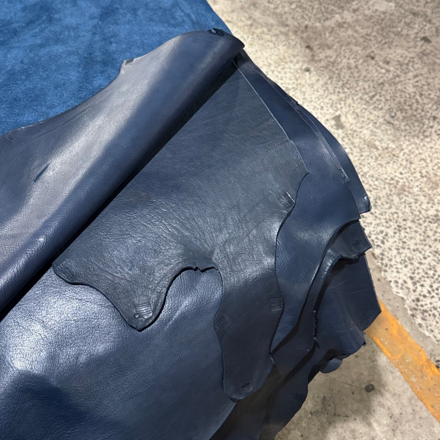 Blue tarp on a vehicle in an industrial setting